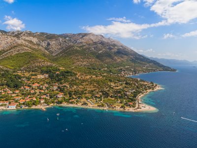 Helicopter aerial shoot of sandy beach Zrnovo near Orebic on Peljesac peninsula, Croatia. World known surfers destination