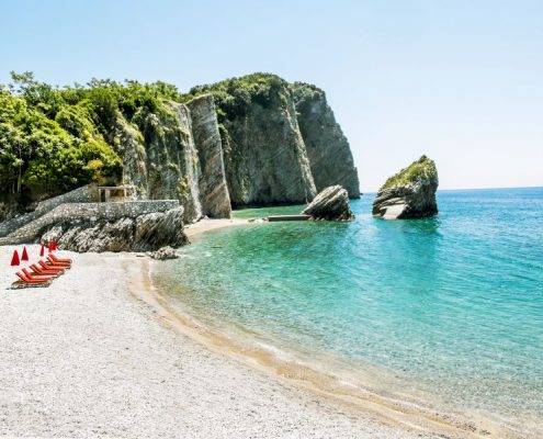 The Beach And The Cliffs On The Island Of St. Nicholas In Budva,