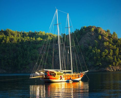 Traditional gulet anchored in the calm bay of Skopea Limani,