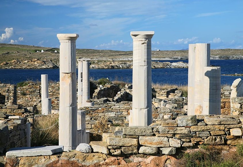 View-overlooking-Cleopatras-House-and-the-ruins-of-Delos-towards-the-shore.-The-Greek-island-of-Delos-is-one-of-the-most-important-historical-and-archaeological-sites-in-G